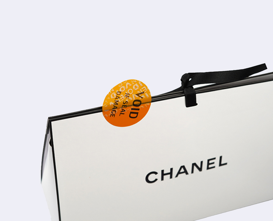 security sitcker on a chanel paper bag